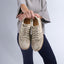 Person holding the Balboa Sneaker in metallic suede