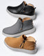 Three pairs of laguna zip bootie in black, gray, and brown on a light gray background