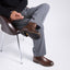 Man sitting on a chair wearing featherlight chelsea boots