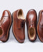 Group shot of Heritage collection shoes in cognac leather. 