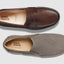 Brown and gray loafers with 'Samuel Hubbard' branding on a light gray background