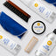 Collection of shoe care products including a brush, cleaner, cream, and protector on a white background.
