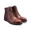 Pair of brown leather boots on a white background